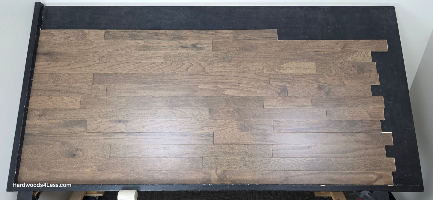 3" x 3/8" Engineered Red Oak Mace Hardwood Flooring. Shown on a black shooting table. Shot from center.