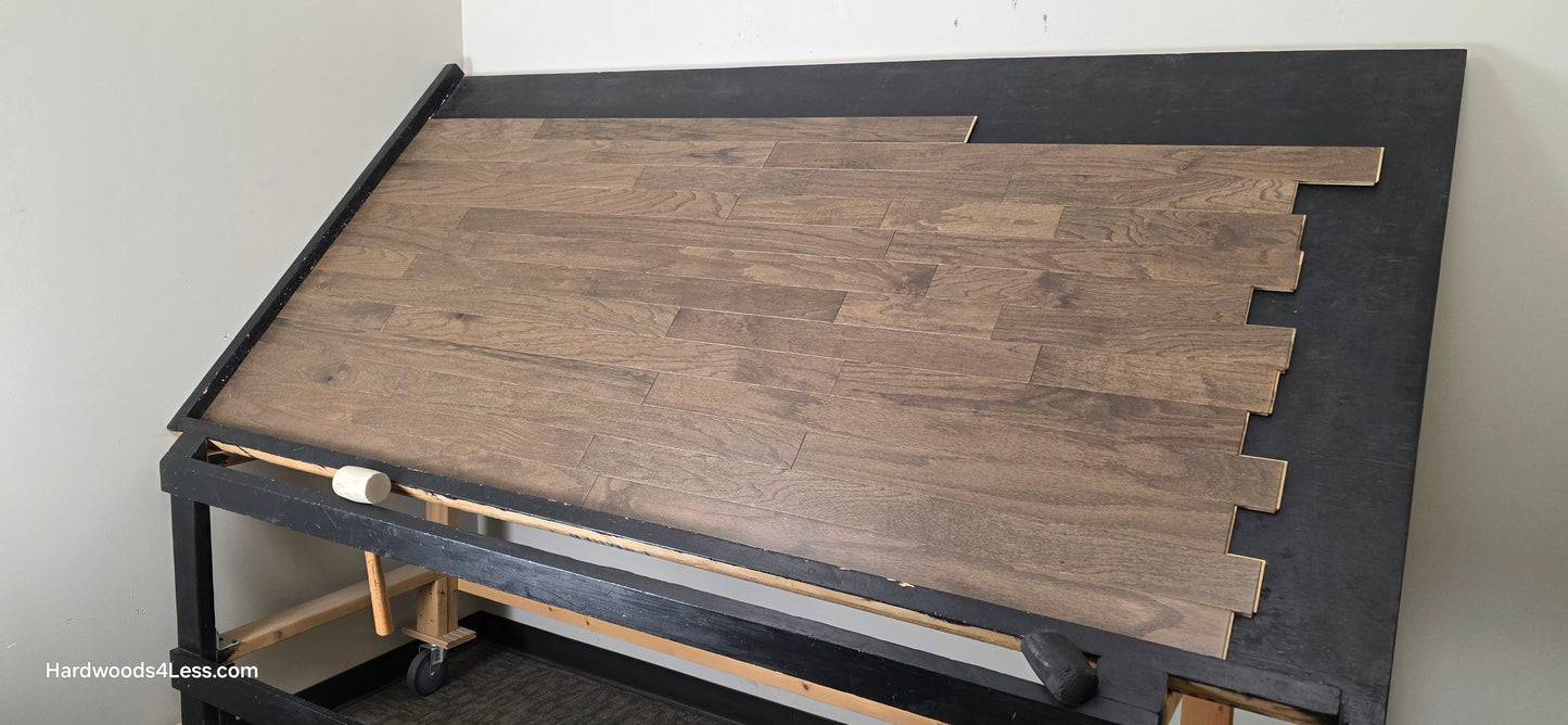 3" x 3/8" Engineered Red Oak Mace Hardwood Flooring. Shown on a black shooting table. Shot from wide right.