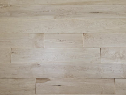 Maple HardWood flooring with a light brown color and visible grain pattern.