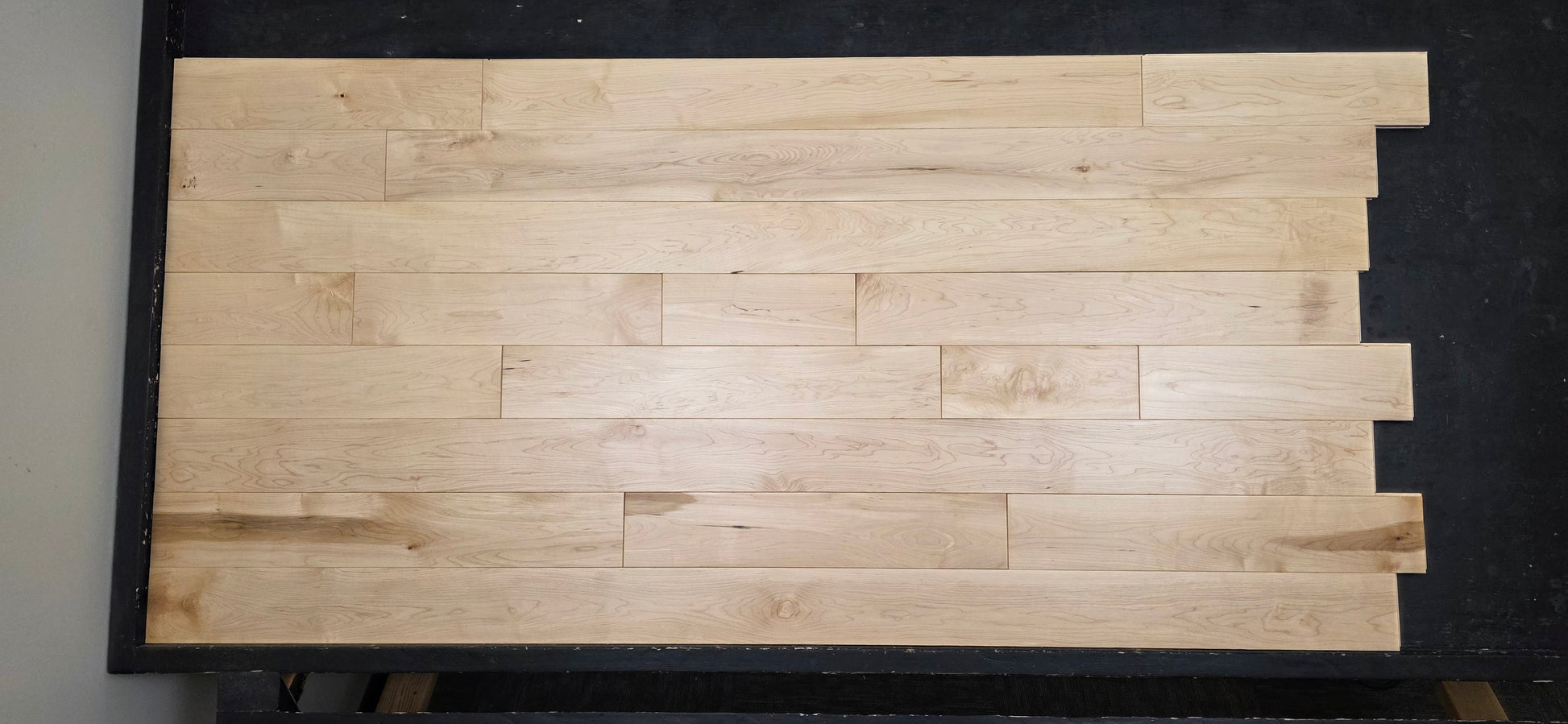 Maple HardWood flooring with a light brown color and visible grain pattern.