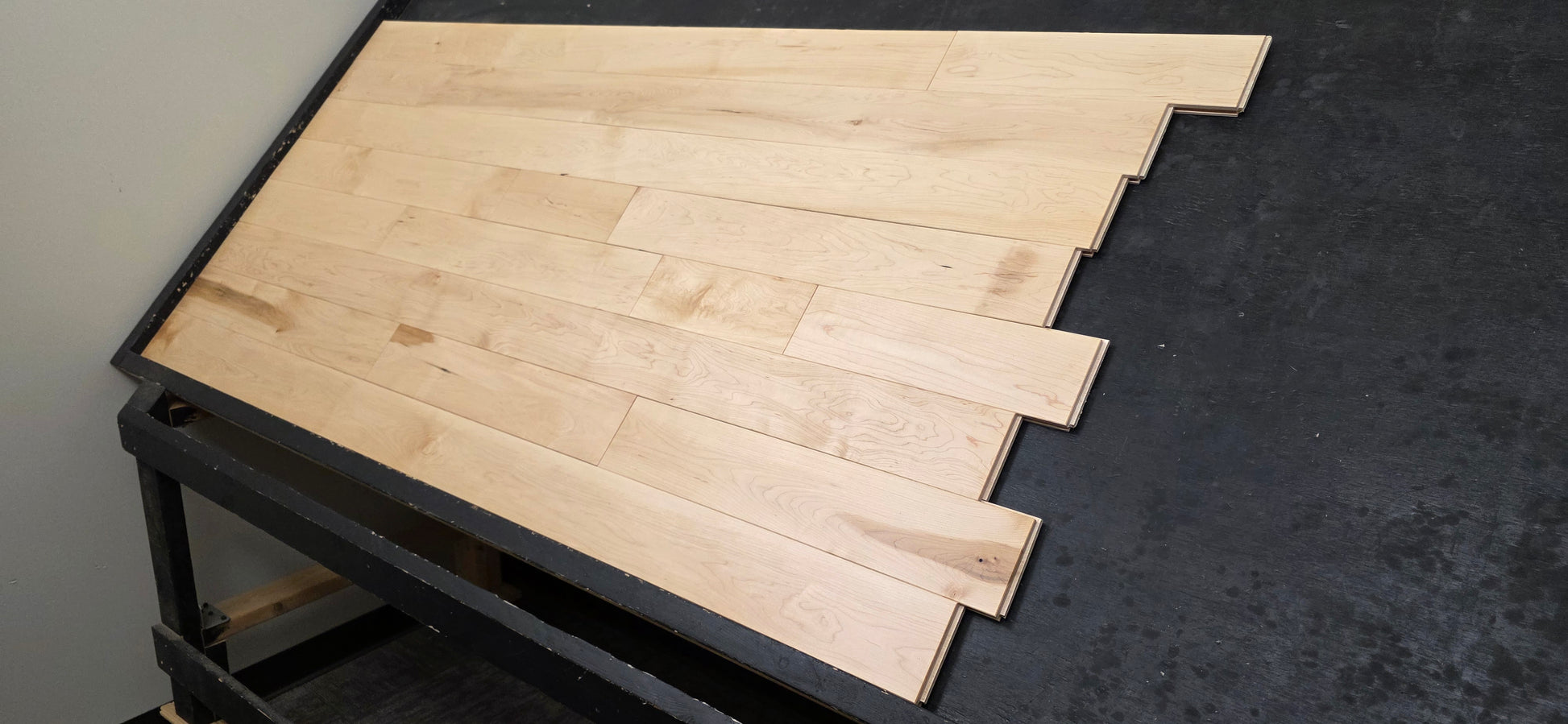 Maple HardWood flooring with a light brown color and visible grain pattern.