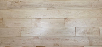 Maple HardWood flooring with a light brown color and visible grain pattern.