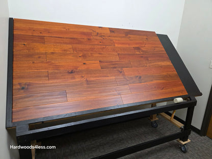 4 3/4" x 3/4" Solid Acacia Ancient Copper Hardwood Flooring. Shown on a black shooting table. Shot from wide left. 