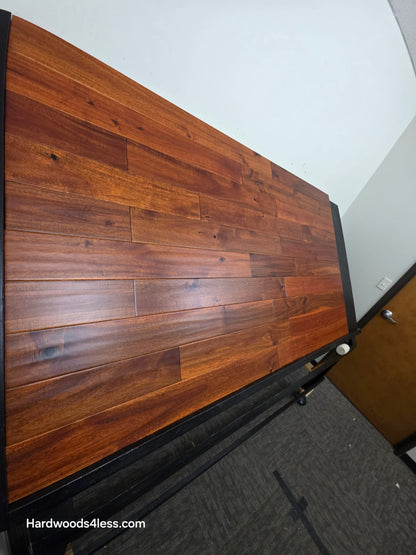 4 3/4" x 3/4" Solid Acacia Ancient Copper Hardwood Flooring. Shown on a black shooting table. Shot from steep left. 