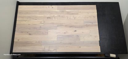 4 3/4" x 3/4" Solid Black Locust Finn Hardwood Flooring. Shown on a black shooting table. Shot from center.