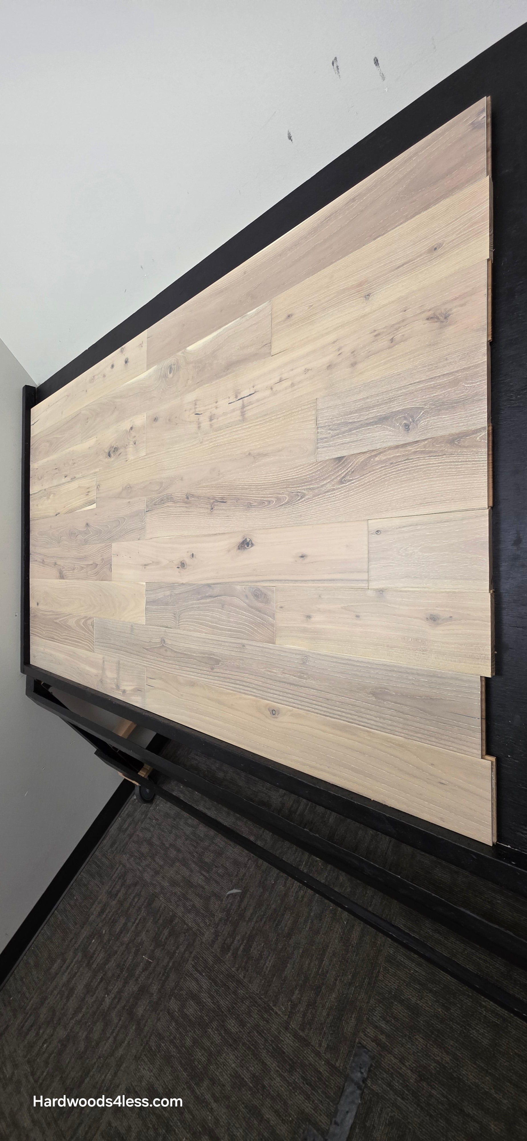 4 3/4" x 3/4" Solid Black Locust Finn Hardwood Flooring. Shown on a black shooting table. Shot from steep left. 