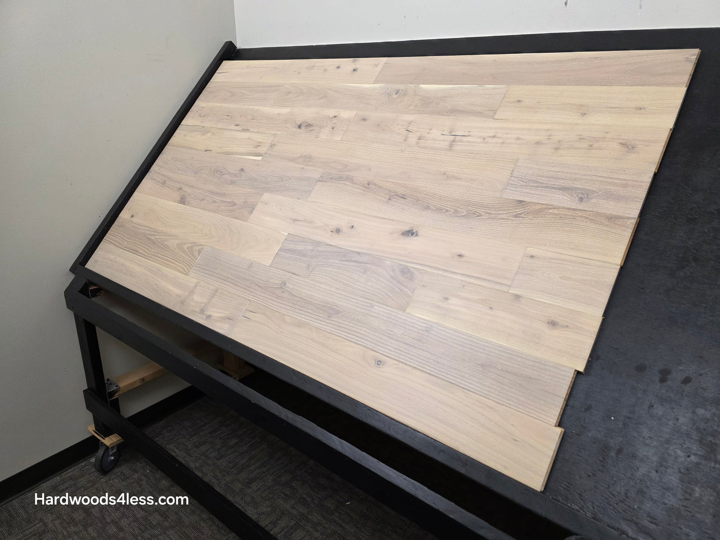 4 3/4" x 3/4" Solid Black Locust Finn Hardwood Flooring. Shown on a black shooting table. Shot from wide right.