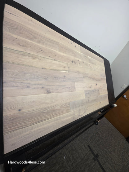 4 3/4" x 3/4" Solid Black Locust Finn Hardwood Flooring. Shown on a black shooting table. Shot from steep left. 