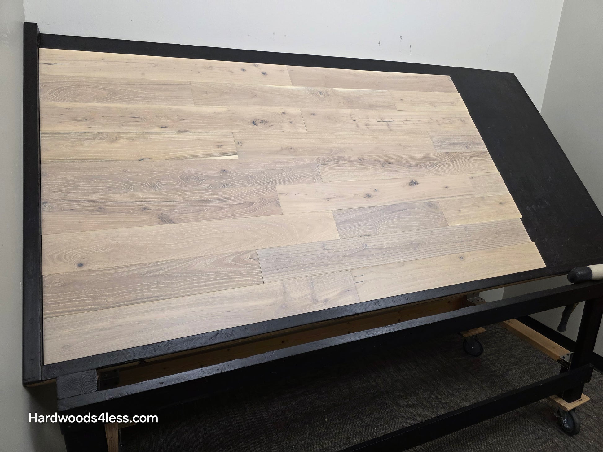 4 3/4" x 3/4" Solid Black Locust Finn Hardwood Flooring. Shown on a black shooting table. Shot from wide left. 