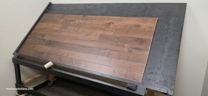 4 5/16" x 5/8" Engineered Maple Cabana Hardwood Flooring. Shown on a a black shooting table. Shot from wide right.