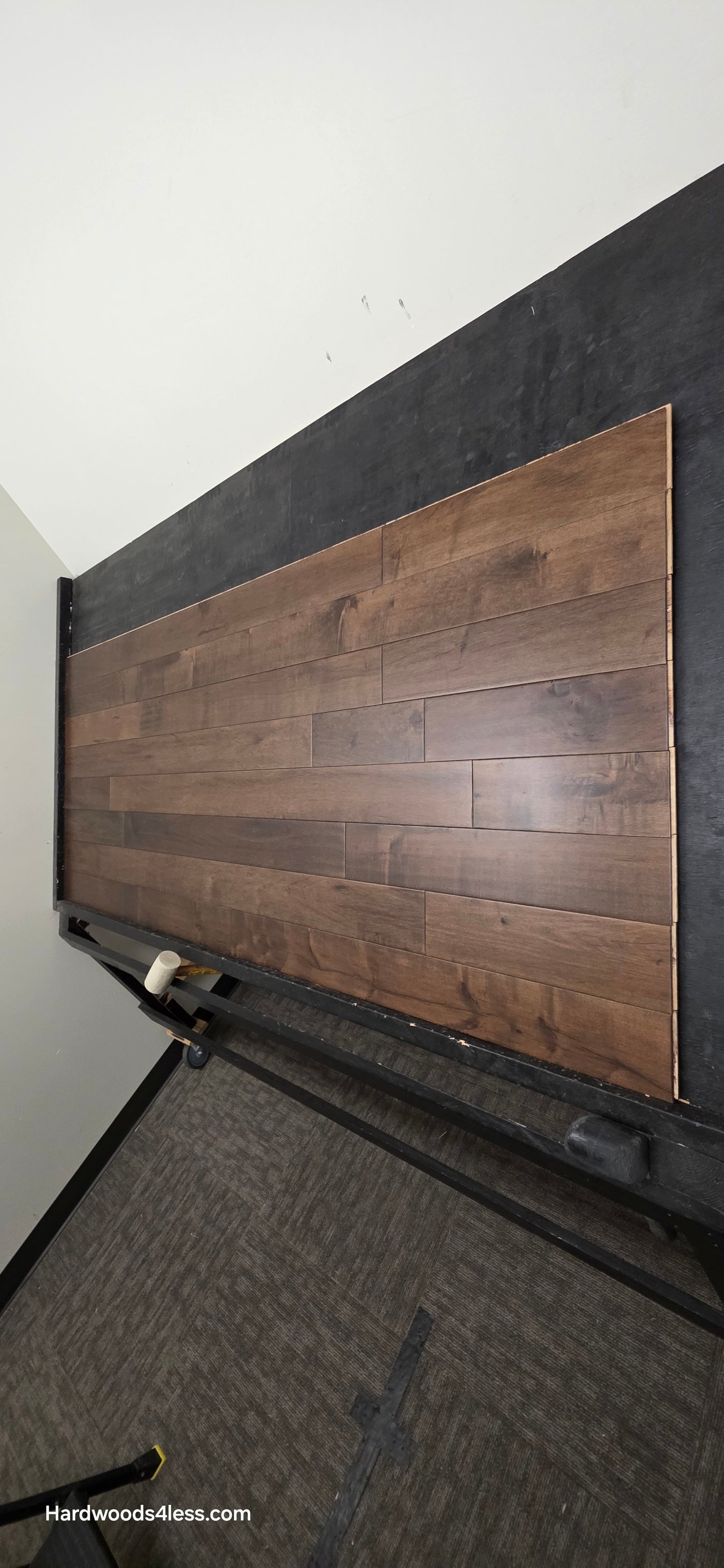 4 5/16" x 5/8" Engineered Maple Cabana Hardwood Flooring. Shown on a a black shooting table. Shot from steep right.
