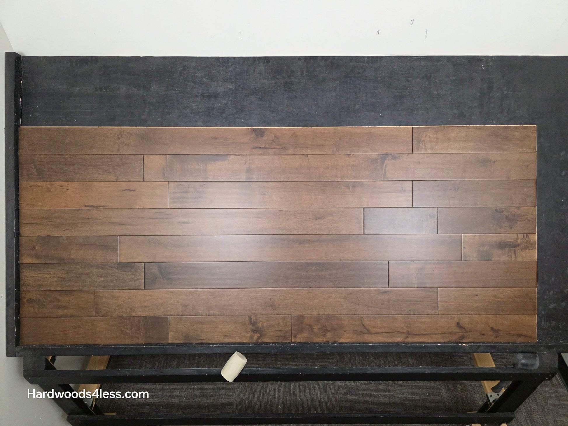 4 5/16" x 5/8" Engineered Maple Cabana Hardwood Flooring. Shown on a a black shooting table. Shot from center.
