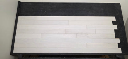4" x 3/4" Solid Brazilian Oak Urso Hardwood Flooring on a black shooting table, head on shot. 