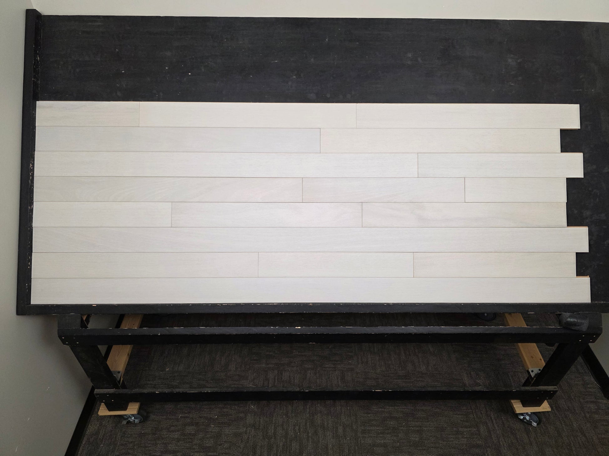 4" x 3/4" Solid Brazilian Oak Urso Hardwood Flooring on a black shooting table, head on shot. 