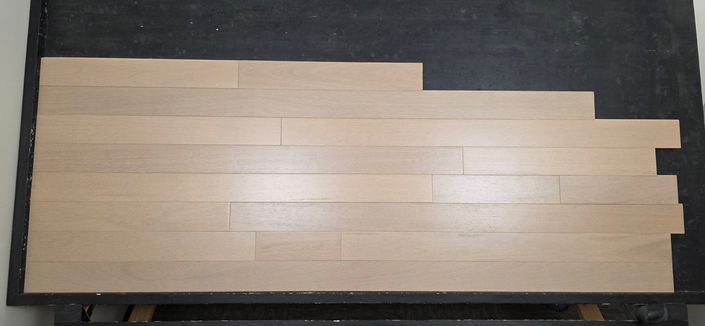 4" x 3/4" Solid Brazilian Oak Deriva Hardwood Flooring on a black racking table shot head on 
