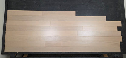 4" x 3/4" Solid Brazilian Oak Deriva Hardwood Flooring on a black racking table shot head on 