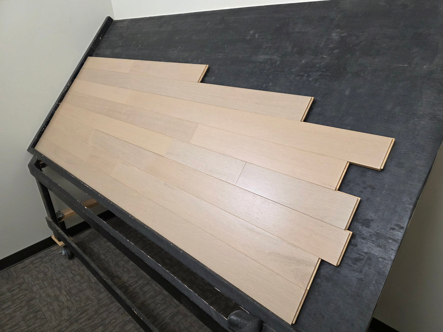 4" x 3/4" Solid Brazilian Oak Deriva Hardwood Flooring on a black racking table shot from the right hand side