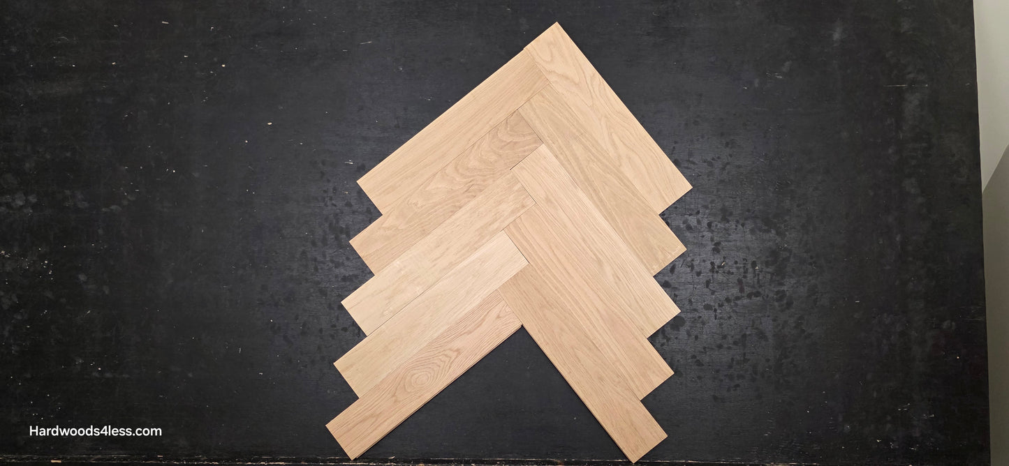 4" x 20" x 3/4" Solid Unfinished White Oak Herringbone Hardwood Flooring. Shown on a black shooting table. Shot from center.