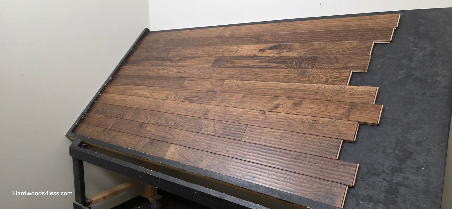 4" x 3/4" Hickory Calico Hardwood Flooring. Shown on a black shooting table. Shot from the right hand side. 