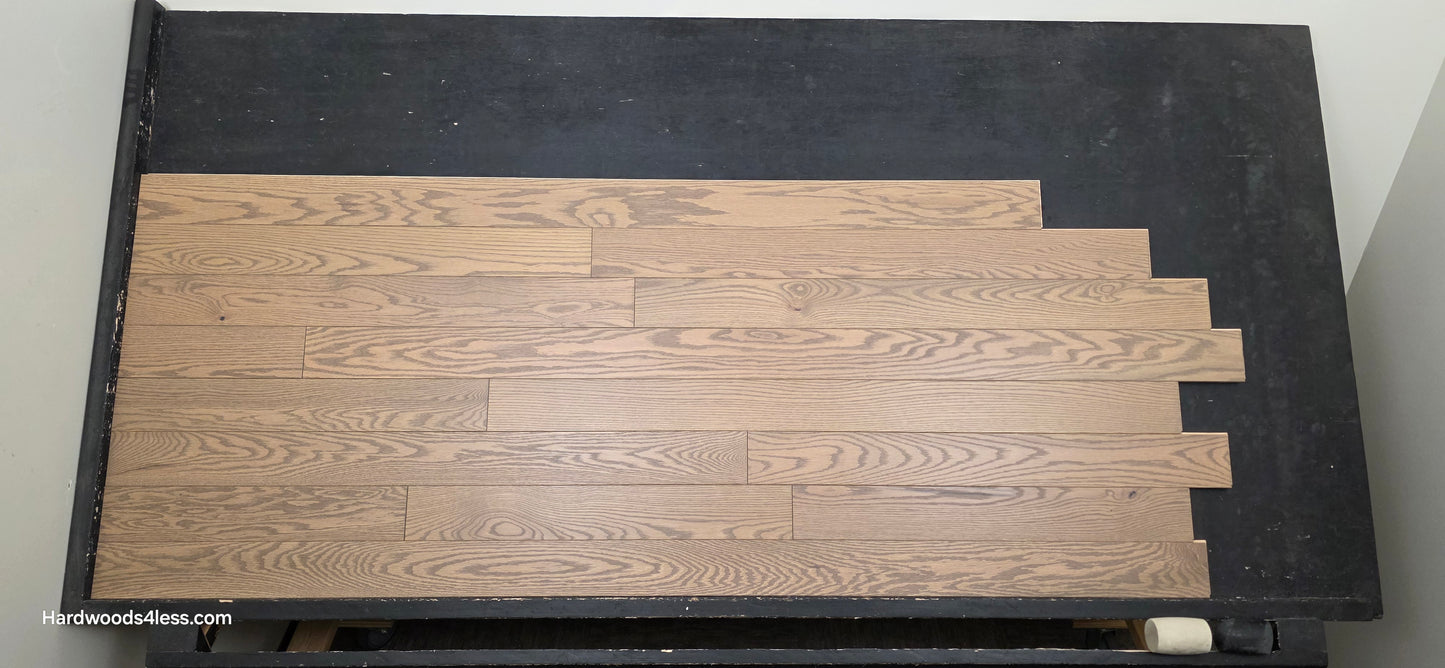 4" x 3/4" Solid Red Oak Barrel Hardwood Flooring. Shown on a black shooting table. Shot from center.