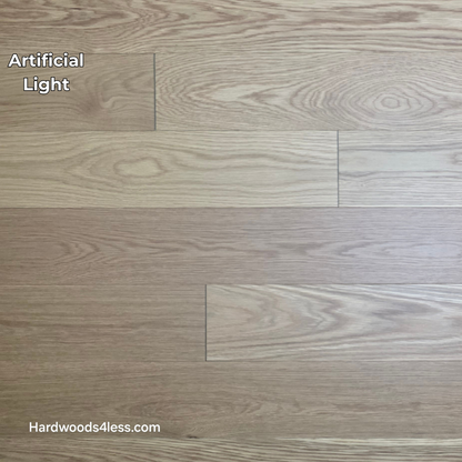 5 1/8" x 1/2"  Engineered White Oak Select & Better Natural Hardwood Flooring. Shown in artificial lighting.