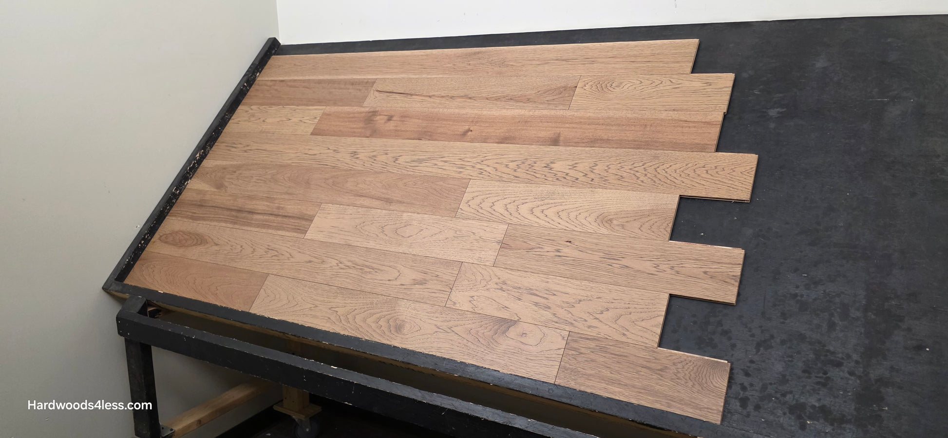 5 38 x 12 Engineered Hickory Cunningham Hardwood Flooring. Shown on a black shooting table. Shot from wide right.