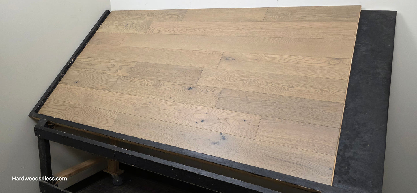 5 7/8" x 9/16" Engineered European Oak Cades Cove Hardwood Flooring. Shown on a black shooting table from the right side. 