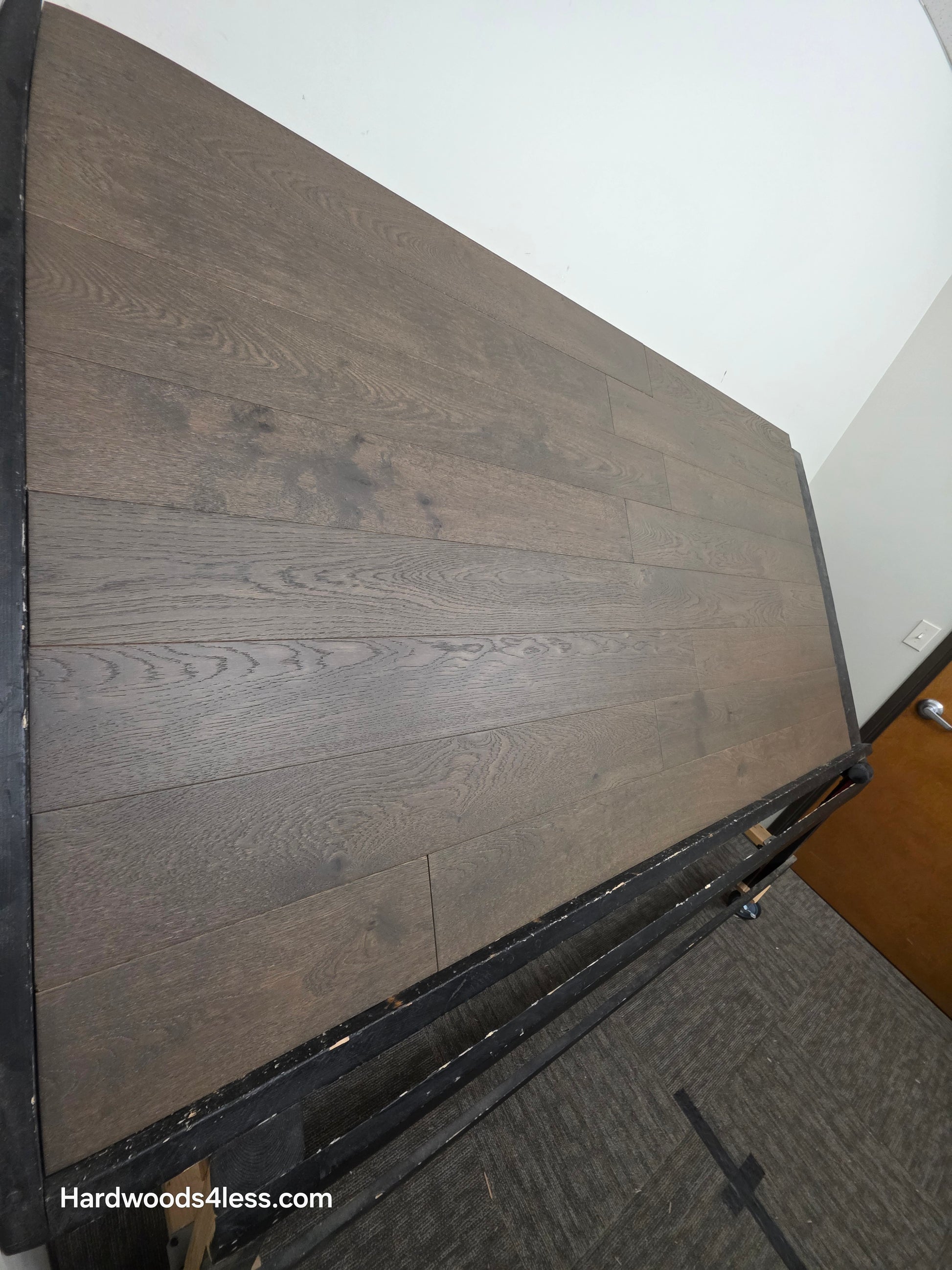 5 7/8" x 9/16" Engineered European Oak Mount Mitchell Hardwood Flooring. Shown on a black shooting table. Shot from the left side. steep angle. 