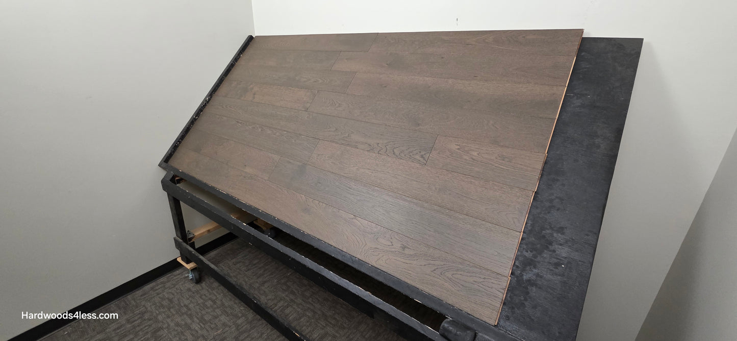 5 7/8" x 9/16" Engineered European Oak Mount Mitchell Hardwood Flooring. Shown on a black shooting table shot from the right hand side. 