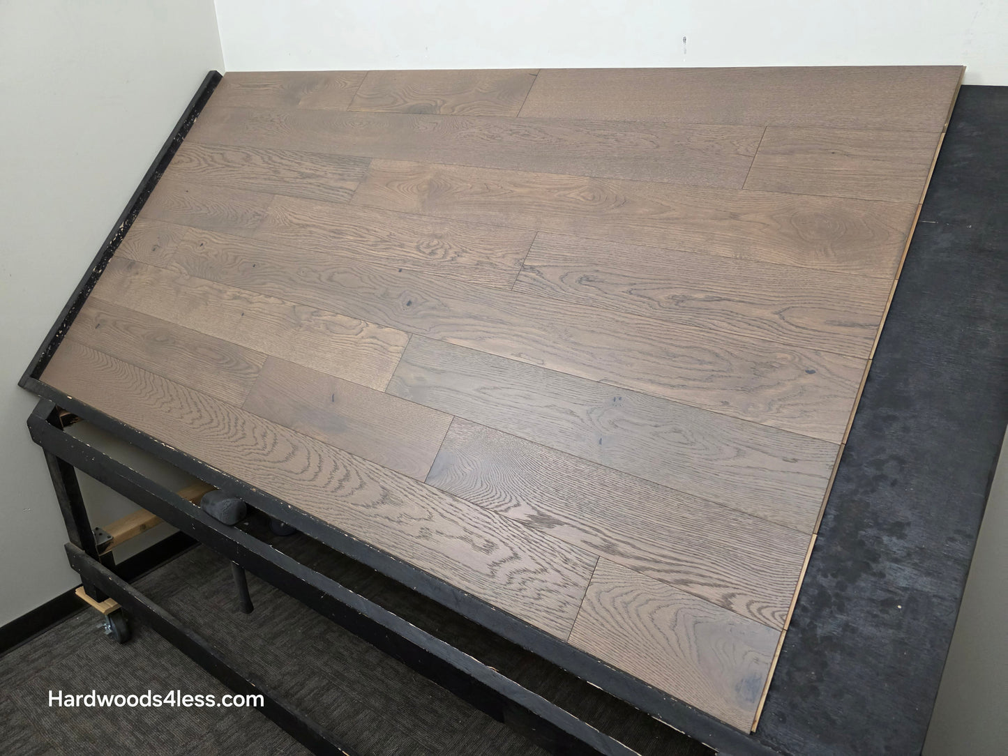 5 7/8" x 9/16" Engineered European Oak Roanoke Ridge Hardwood Flooring shown on a black shooting table. Shot from the right hand side.