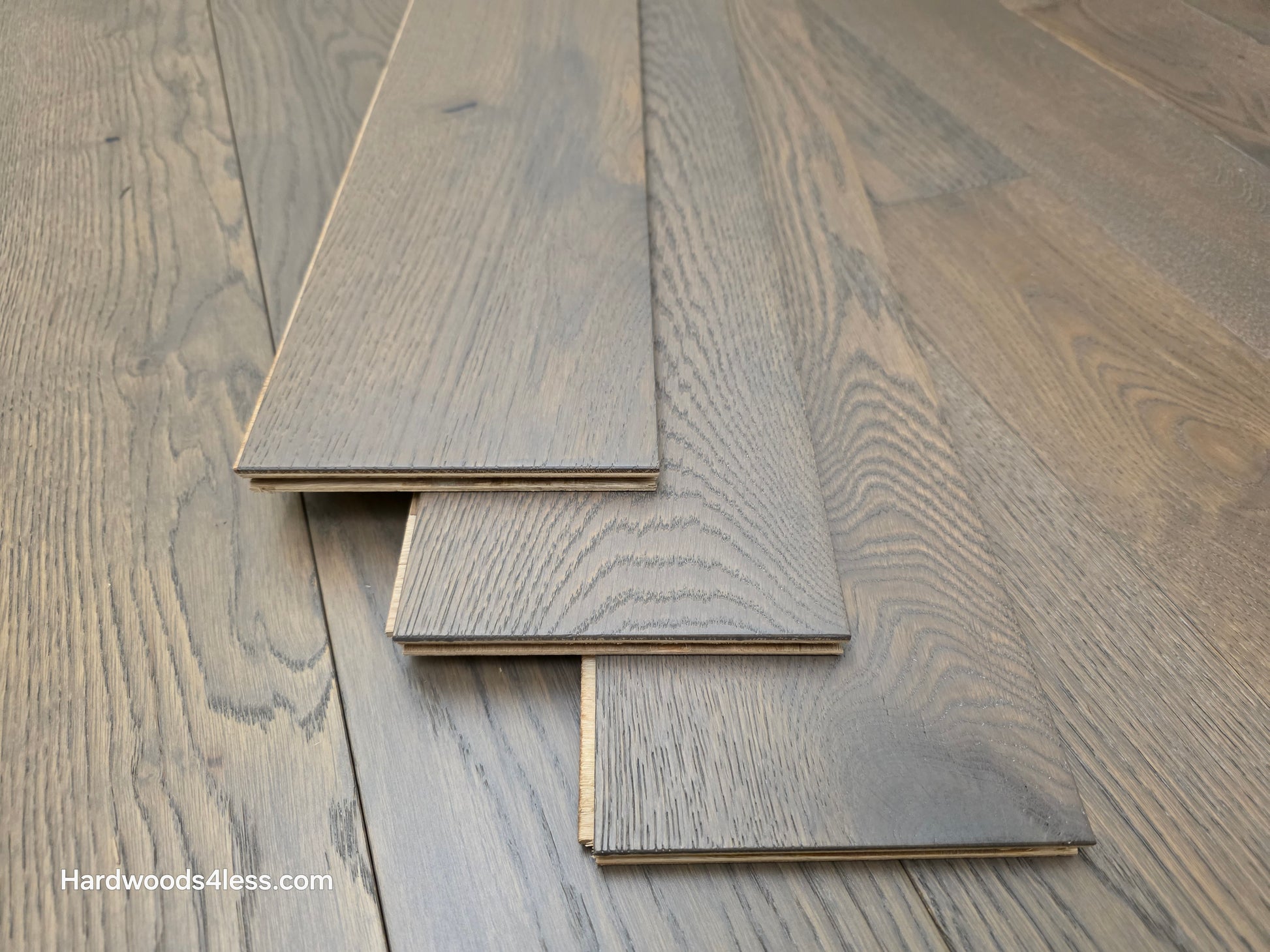 5 7/8" x 9/16" Engineered European Oak Roanoke Ridge Hardwood Flooring shown with three boards stacked atop eachother.