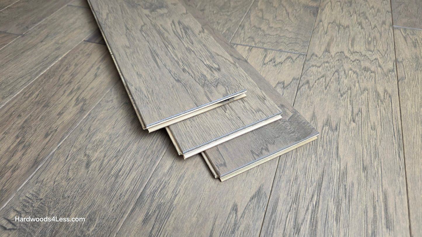 5" x 1/2" Engineered Hickory Flagstone Hardwood Flooring. Shown as 3 boards stacked on top of the Hickory hardwood flooring.