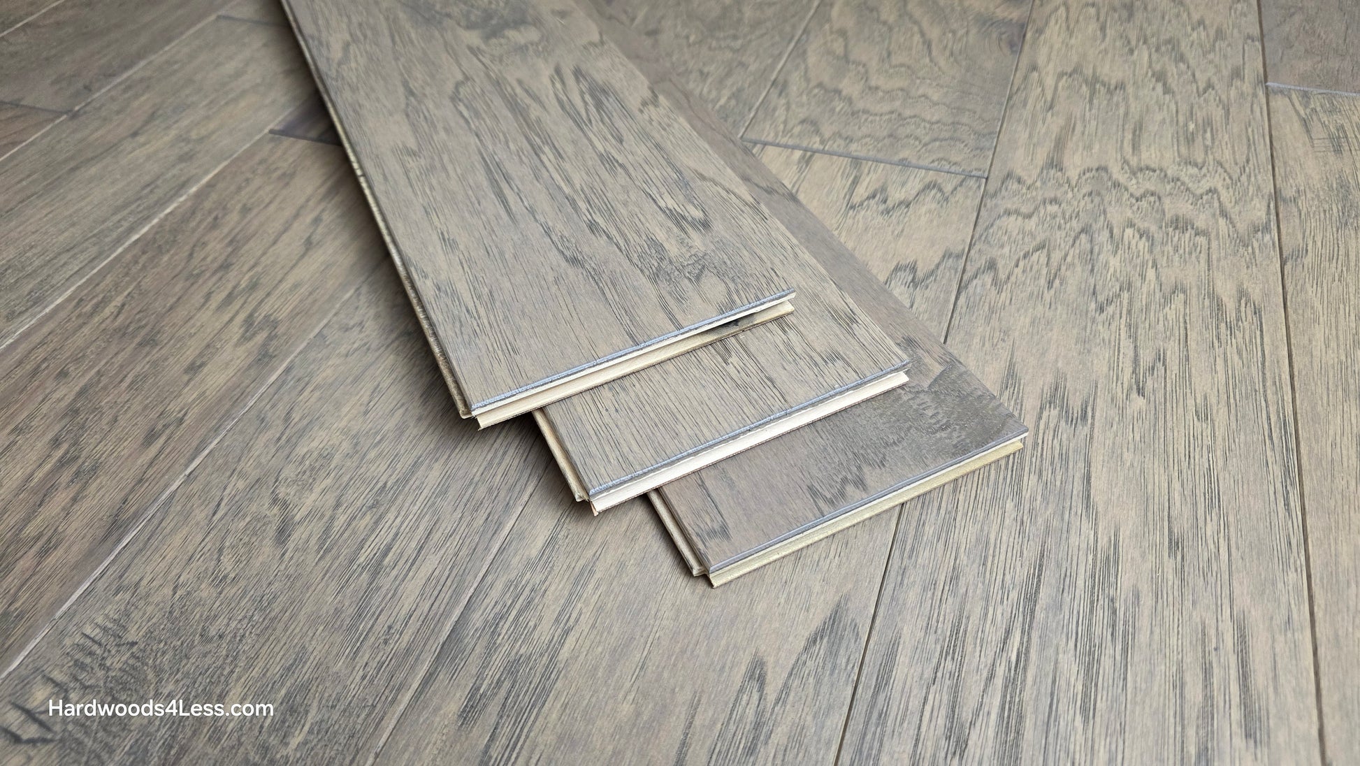 5" x 1/2" Engineered Hickory Flagstone Hardwood Flooring. Shown as 3 boards stacked on top of the Hickory hardwood flooring.
