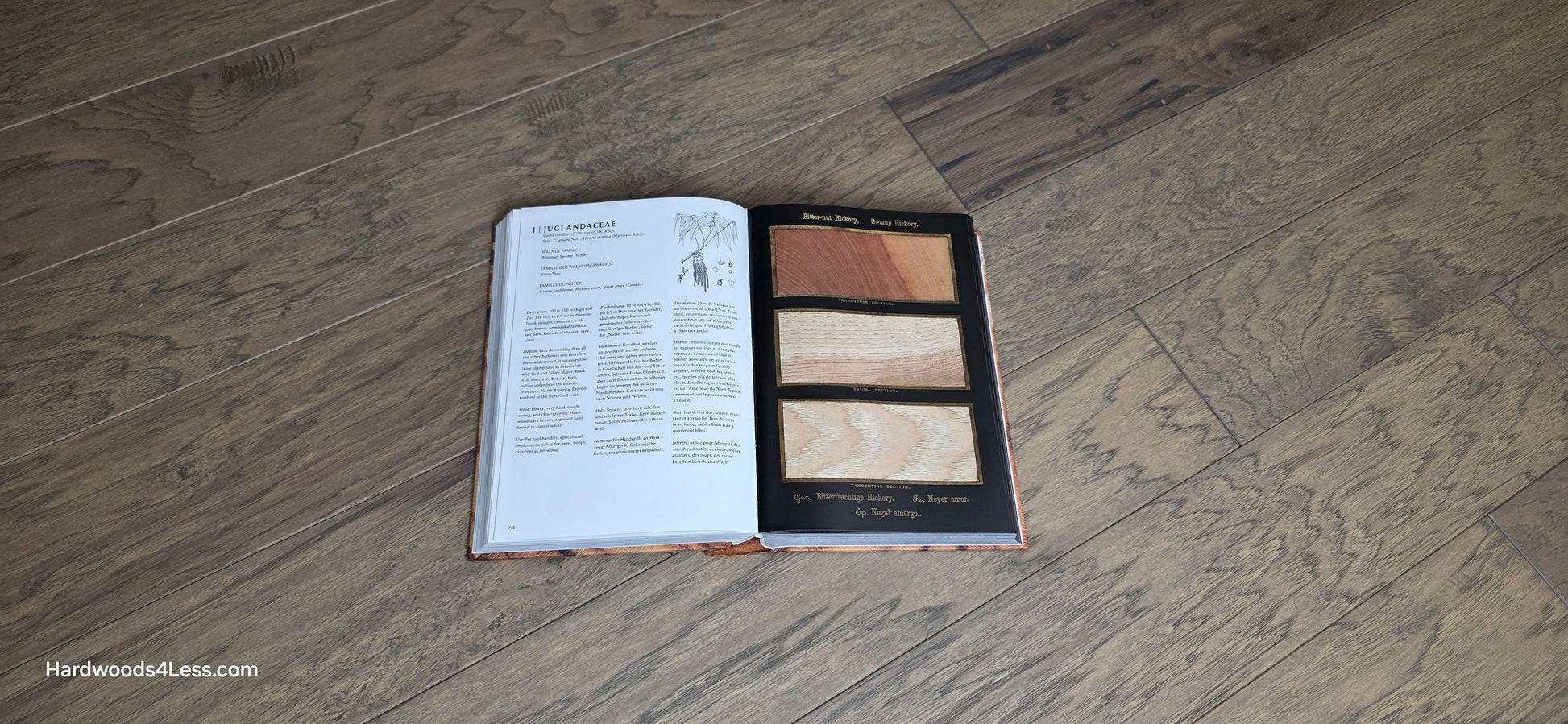5" x 1/2" Engineered Hickory Flagstone Hardwood Flooring. Shown at center is a Hardwood book opened to a Hickory page. Under the book is the Hickory hardwood flooring.
