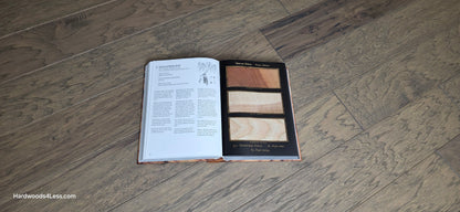 5" x 1/2" Engineered Hickory Flagstone Hardwood Flooring. Shown at center is a Hardwood book opened to a Hickory page. Under the book is the Hickory hardwood flooring.