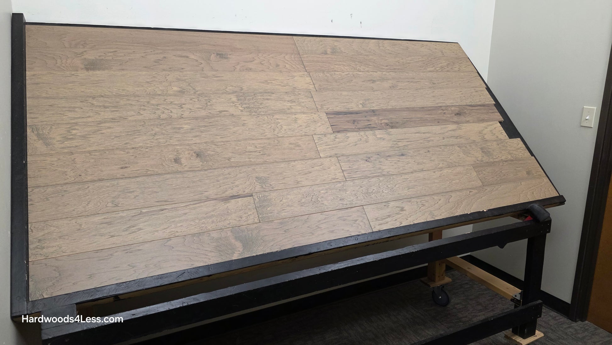 5" x 1/2" Engineered Hickory Flagstone Hardwood Flooring. Shown on a black shooting table. Shot from wide left.