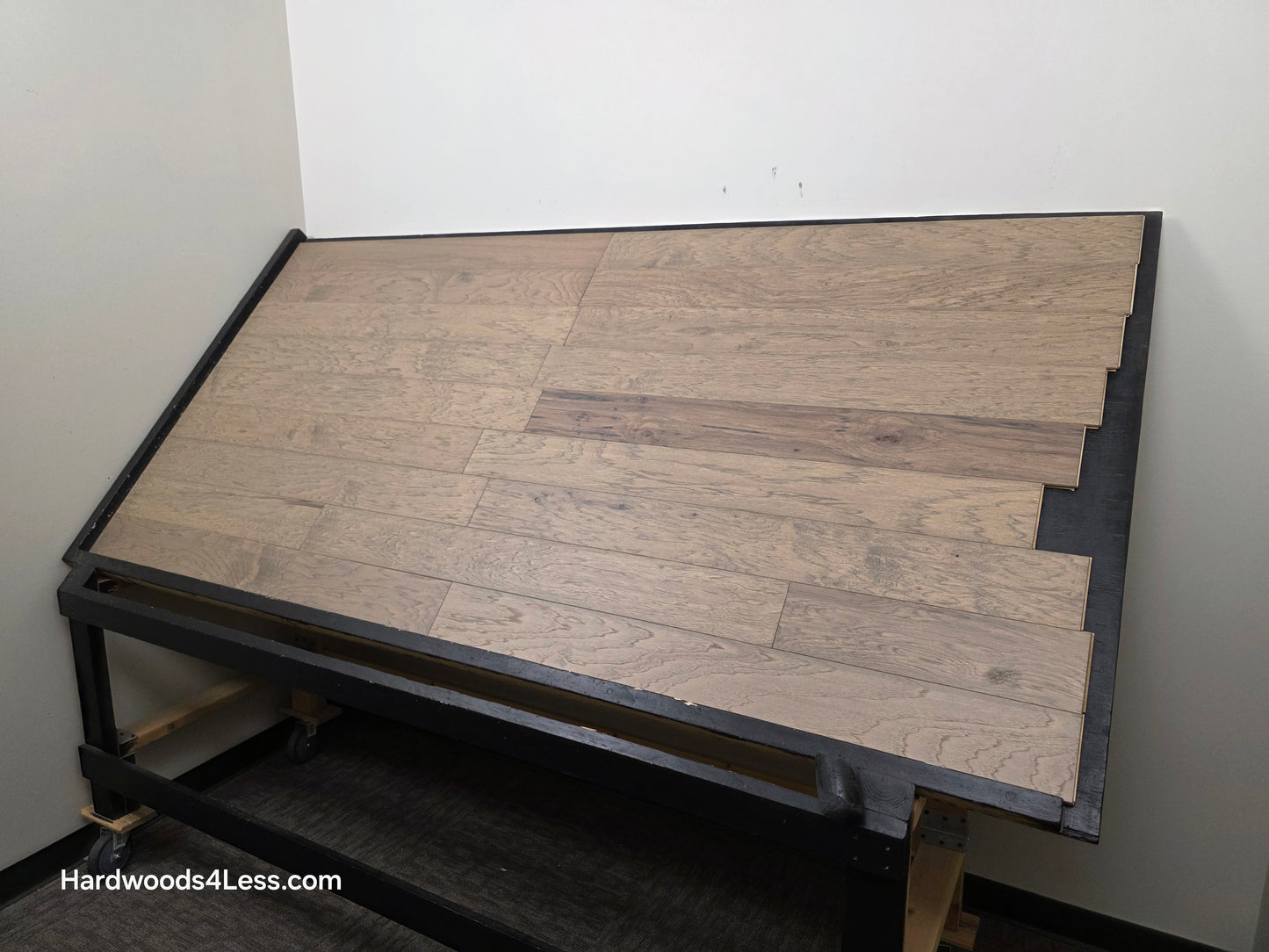 5" x 1/2" Engineered Hickory Flagstone Hardwood Flooring. Shown on a black shooting table. Shot from wide right.