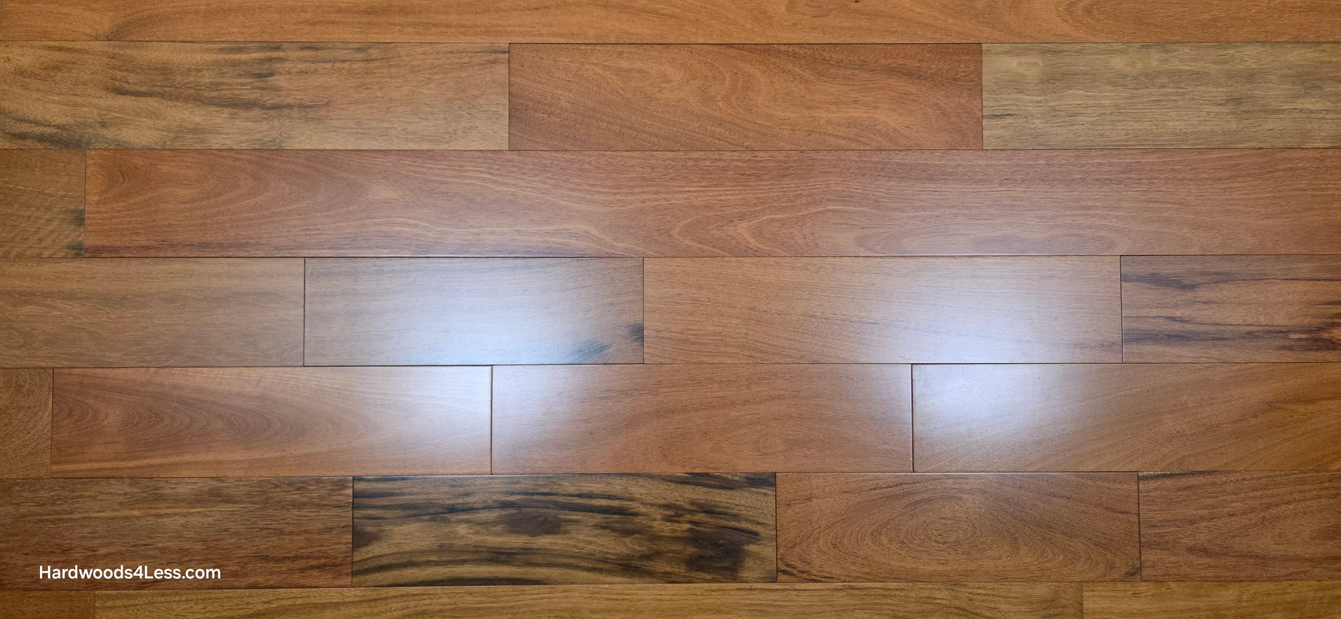 5" x 3/4" Prefinished Brazilian Cherry Shorts Hardwood Flooring. Show close up with a wide format.