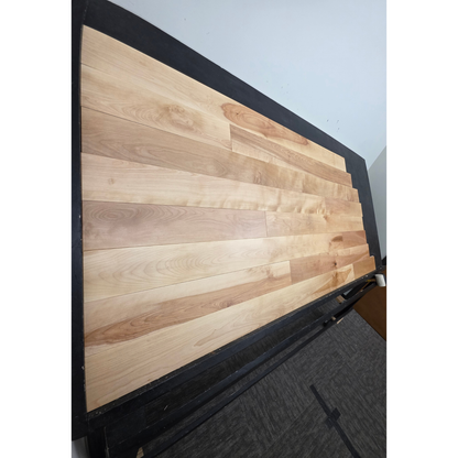 5" x 3/4" Solid Yellow Birch Natural Hardwood Flooring shown on a black shooting table. Shot from steep left. 