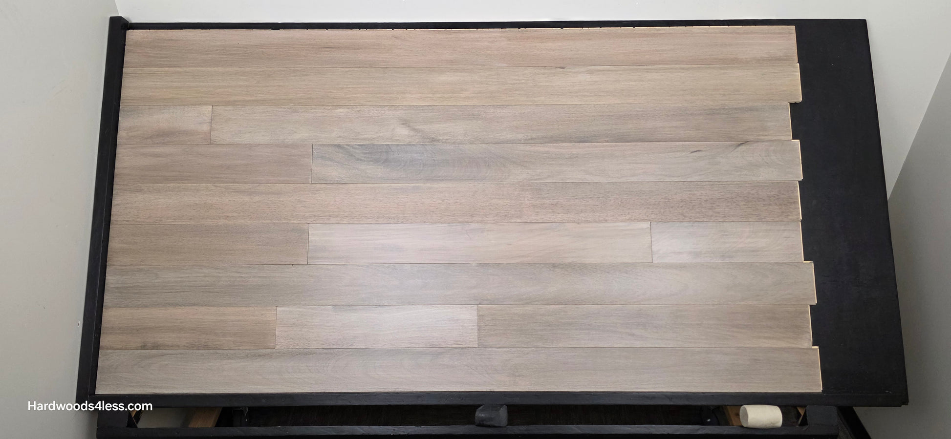 5" x 9/16" Engineered Brazilian Oak Light Grey Hardwood Flooring. Shown on a black shooting table. Shot from center.