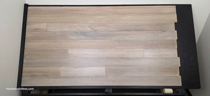 5" x 9/16" Engineered Brazilian Oak Light Grey Hardwood Flooring. Shown on a black shooting table. Shot from center.