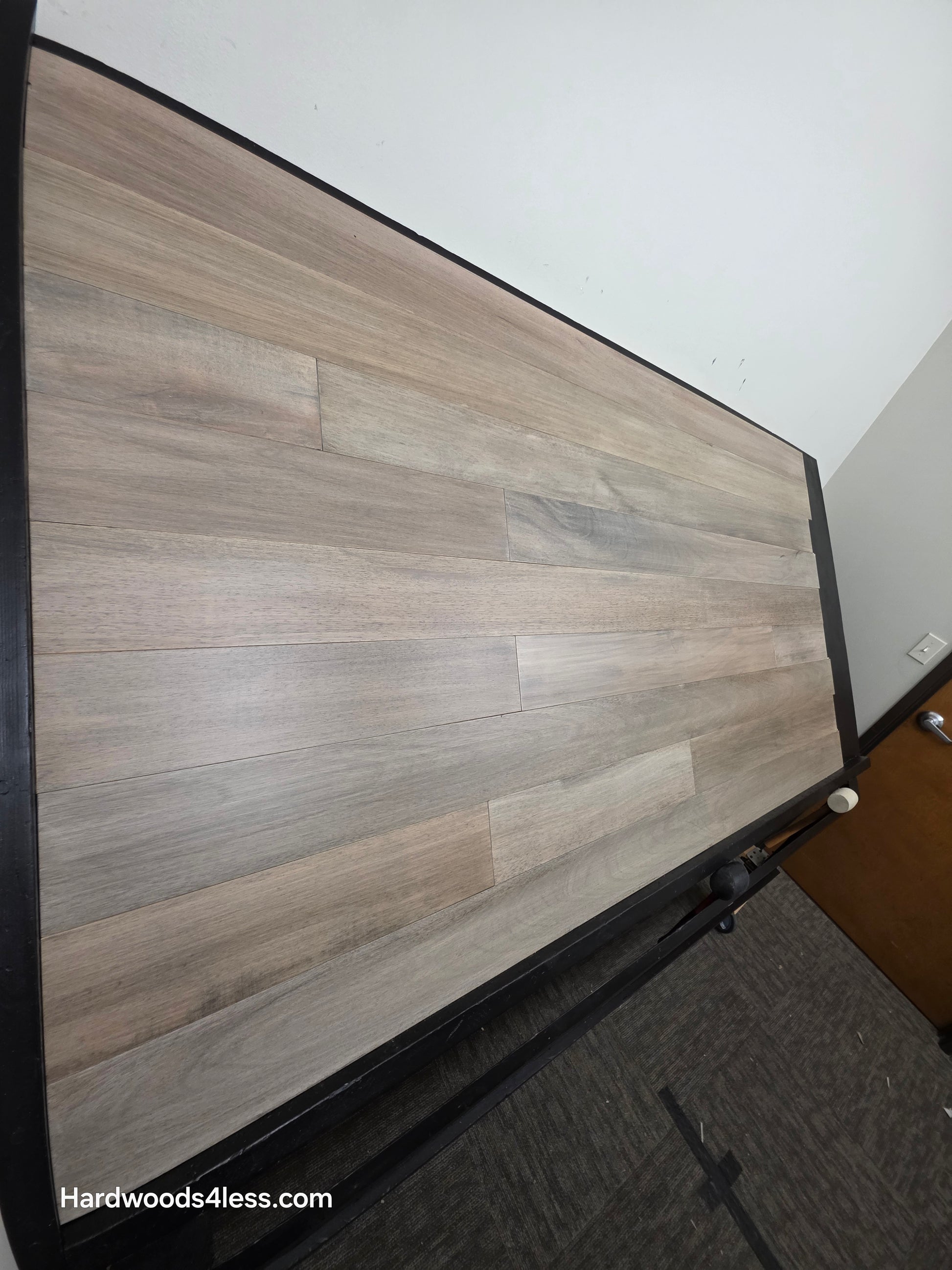 5" x 9/16" Engineered Brazilian Oak Light Grey Hardwood Flooring. Shown on a black shooting table. Shot from steep left.