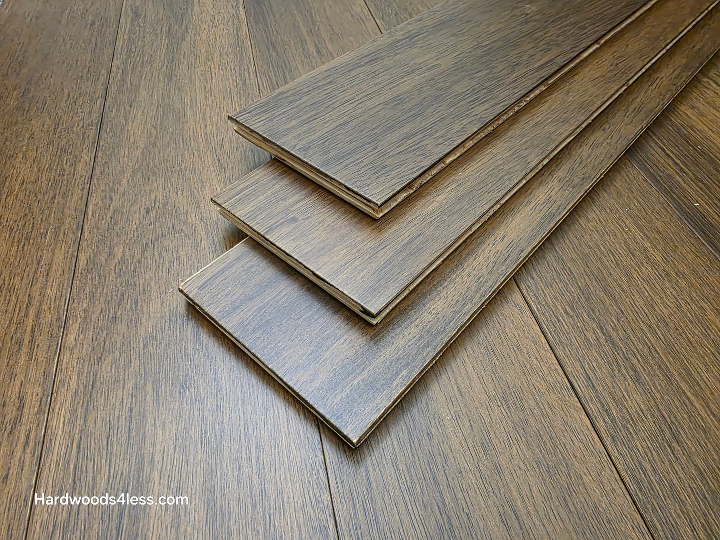 5" x 9/16" Engineered Brazilian Oak Pebble Hardwood Flooring. Shown as the flooring stacked in a set of three on top of the floor. 