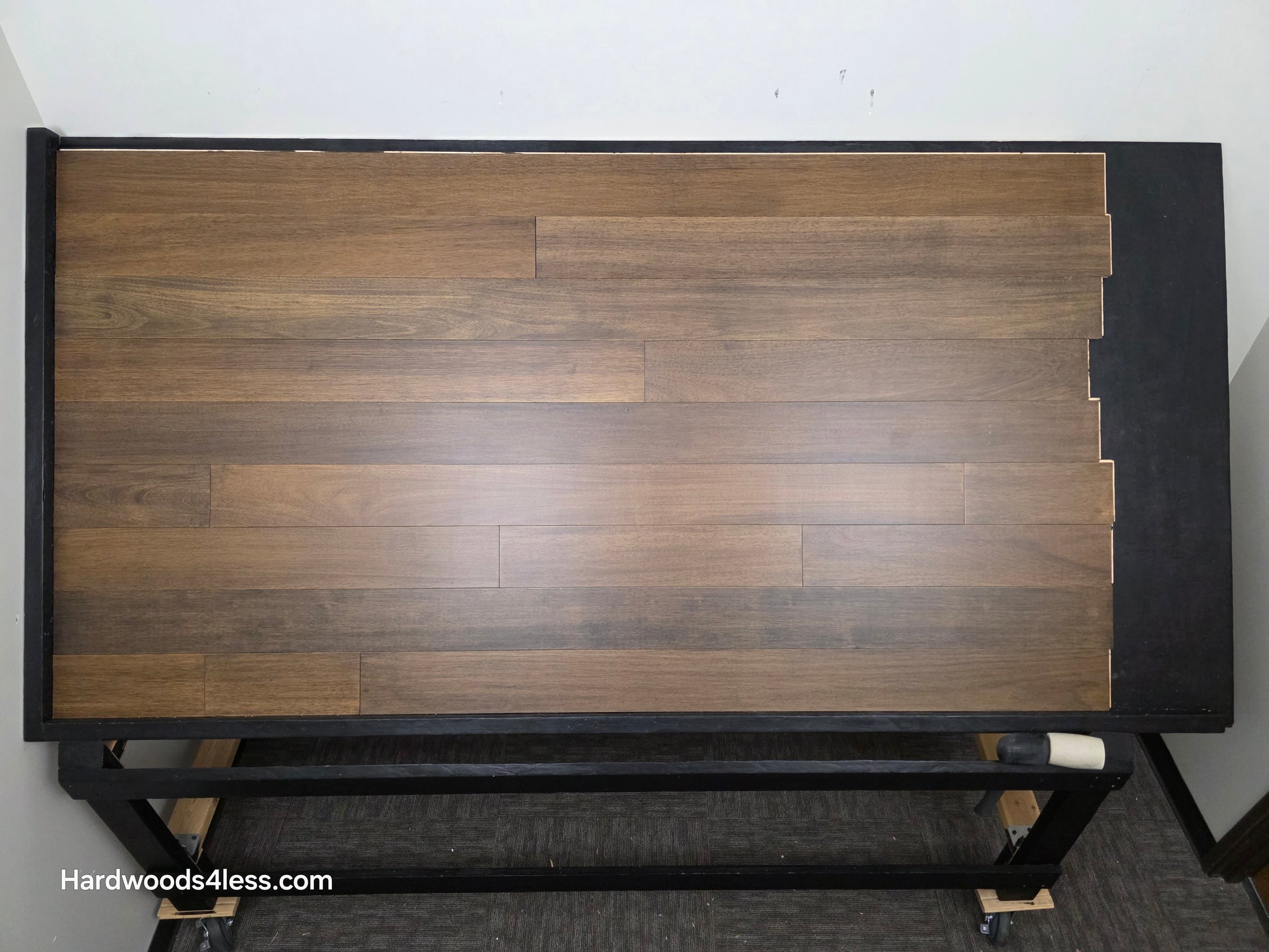 5" x 9/16" Engineered Brazilian Oak Pebble Hardwood Flooring. Shown on a black shooting table. shot from center