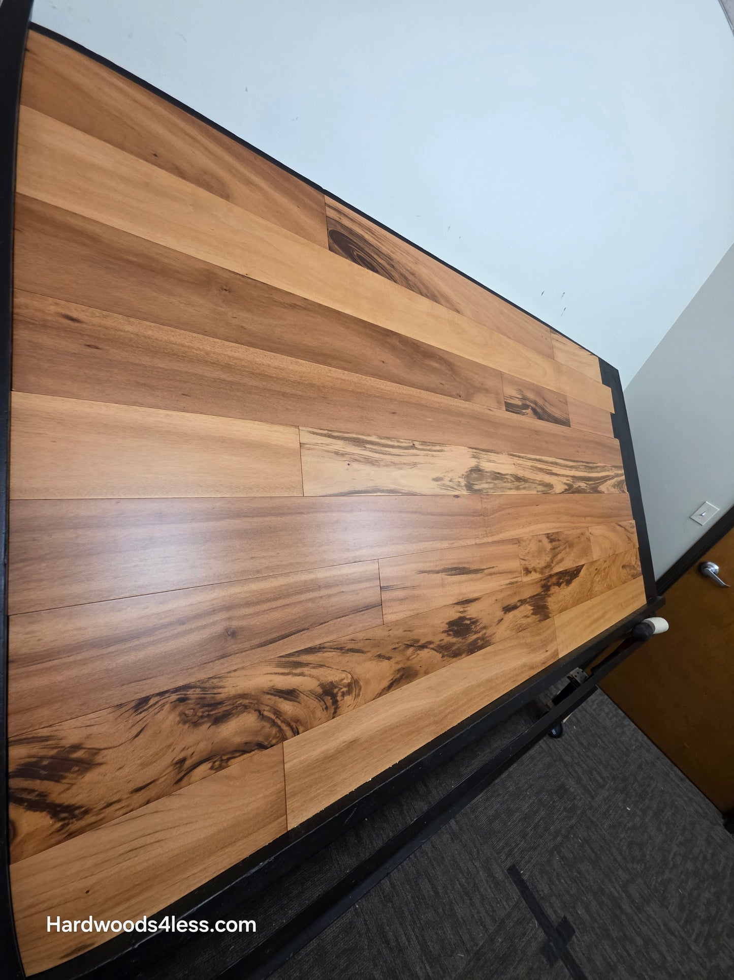 5" x 9/16" Engineered Brazilian Tigerwood Natural Hardwood Flooring. Shown on a black shooting table. Shot from steep left.