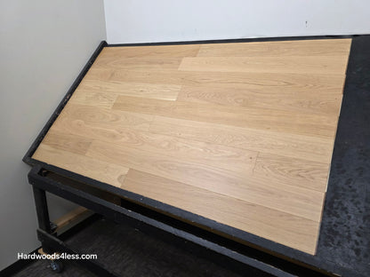 5" x 9/16" Engineered European Oak Natural Hardwood Flooring. shown on a black shooting table. shot from the right side. 