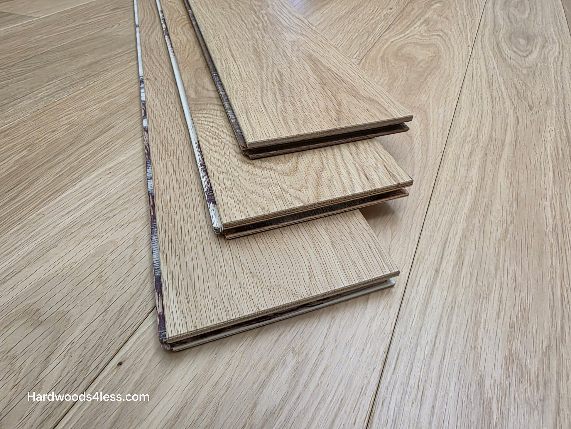 5" x 9/16" Engineered European Oak Natural Hardwood Flooring. Shown as 3 tiles stacked on the floor.