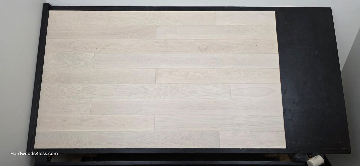 5" x 9/16" Engineered European Oak Vail Hardwood Flooring. Shown on a black shooting table. Shot from center.