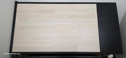5" x 9/16" Engineered European Oak Vail Hardwood Flooring. Shown on a black shooting table. Shot from center.
