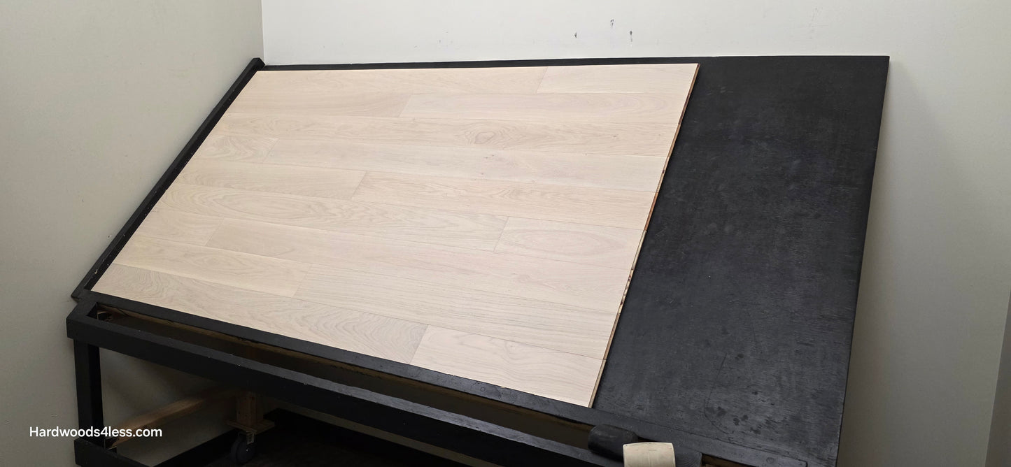 5" x 9/16" Engineered European Oak Vail Hardwood Flooring. Shown on a black shooting table. Shot from wide right.